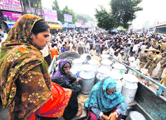 Gujjars protest near exhibition ground to show their resentment against the alleged highhandedness of civic body officials and in support of their demand for increase in prices of milk in Jammu