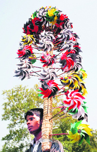 A vendor sells pinwheels on a roadside in Srinagar.
