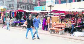Benches installed at Dharam Singh Market on the way to the Golden Temple for the convenience of tourists have been encroached upon by vendors and shopkeepers in Amritsar.