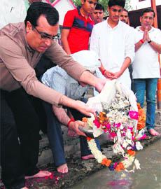 Congress general secretary Ajay Maken immerses ashes of his father CP Maken in the Ganga at Kankhal in Haridwar on Thursday.