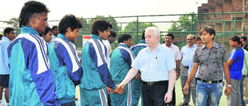 RK Arora, Registrar, Deenbandhu Chhotu Ram University of Science and Technology, Murthal, greets players during the inaugural ceremony of the North Zone Inter-University Lawn Tennis Championship in the university. 