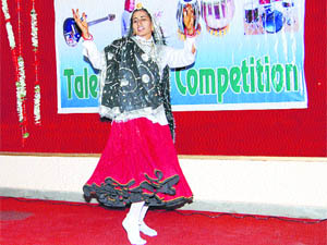 A student presents a dance during the talent search competition at MM College of Education in Fatehabad. 
