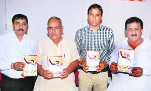 Dr Ram Prakash, Chancellor, Gurukul Kangri University, and Rajya Sabha Member (second from left), flanked by Prof Babu Ram (extreme left), Dr Sushil Kumar Taya (third from left), and Subhash Sudha (extreme right), during a book release in Kurukshetra. 
