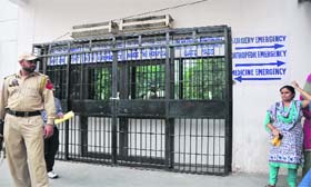 A locked gate of the ward after the collapse in Government Medical College & Hospital in Jammu on Thursday