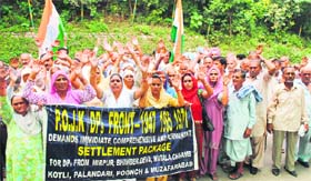 Members of the PoK refugees shout slogans against state government in Jammu on Thursday