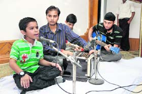 A boy sings a ghazal during a function to commemorate the death anniversary of Jagjit Singh at KL Saigal Hall in Jammu on Thursday