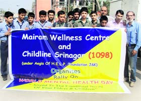 Students and doctors during an awareness rally on World Mental Health Day in Srinagar on Thursday
