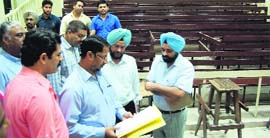 Punjab Medical Education Minister Anil Joshi with officials at the Government Medical College in Amritsar on Friday.