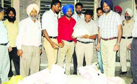 Health Department officials with the seized synthetic khoya in Amritsar on Friday.