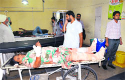 Paramjit Kaur, who was run over by a vehicle, undergoes treatment at the Civil Hospital in Bathinda on Friday.