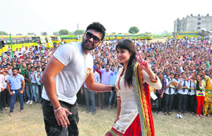 Actors Aryan Babbar and Minissha Lamba promote their upcoming Punjabi film Heer and Hero at Baba Farid College in Bathinda on Friday. 
