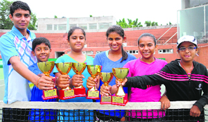 Winners of the CLTA-AITA Super Series Tennis Tournament with their trophies at the CLTA Courts, Sector 10, in Chandigarh on Friday. tribune photo: s chandan