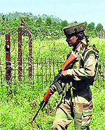 An Army jawan patrols the LoC in Poonch district