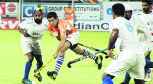 Players in action during the 30th Indian Oil Surjit Hockey Tournament in Jalandhar on Friday.