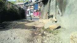The dilapidated condition of the link road to Karewa Mohalla in Bijbehara town. 