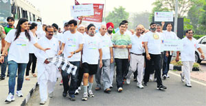 Participants during a Walkathon held on the eve of World Arthritis Day.