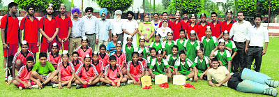 The hockey teams of Nankana Sahib Public Senior Secondary School, Kilaraipur, with their trophies. 