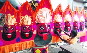 An artist gives finishing touches to an effigy of the demon king Raavan in Amritsar.