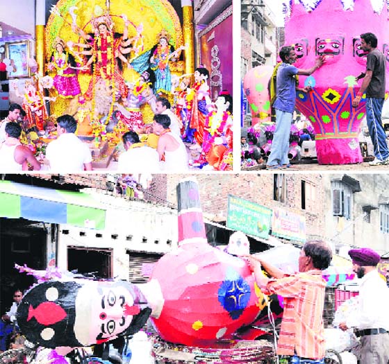Members of the Oriya community celebrate Durga Puja in Amritsar on Saturday; artists give final touches to an effigy of Raavan; an effigy of Raavan being taken to the venue on the eve of Dasehra celebrations.