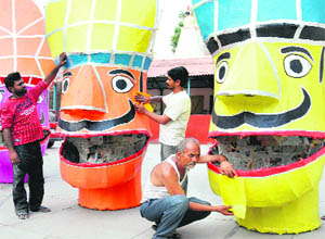 Kalu Ram and his two sons making effigies of Ravana, Kumbhakaran, Meghanad at SSD Girls College in Bathinda. 