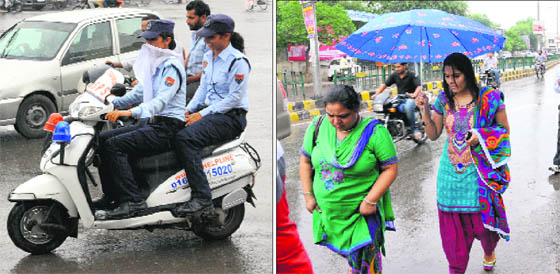 (Left) Members of the Women Armed Special Protection Squad (WASPS); and women brave the rain in Bathinda on Saturday.