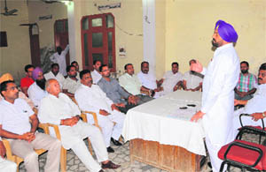 Congress leader and former MLA from Bathinda, Harminder Singh Jassi addresses a party workers meeting in the city on Saturday. 