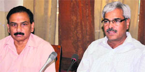 Ashok Gupta, Secretary, Local Bodies, (right) at a meeting in Bathinda on Saturday. 