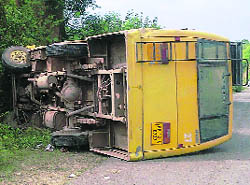 The overturned bus of the nursing college at Dhabota on the Nalagarh-Bharatgarh road on Saturday.