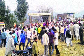 Residents protest against the police over the killing of a school student in Rajouri on Saturday