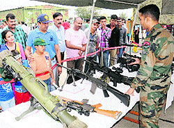 Visitors look at defence equipment to commemorate the 81st anniversary of the Indian Air Force at the Adampur Air Force base on Saturday