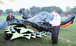 Effigies of demon king Ravana, Meghnad and Kumbhkaran being covered with tarpaulin to protect them from rain ahead of Dasehra in Jalandhar on Saturday