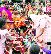 Devotees perform Kanjak Pujan at Devi Talab Mandir in Jalandhar on Saturday. It was the eighth day of Navratras, the day of Maa Gauri, which is celebrated by worshipping young girls