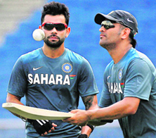 Captain MS Dhoni and Virat Kohli during a practice session ahead of the first ODI in Pune on Saturday.