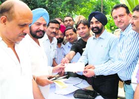 A Municipal Corporation team at a property tax awareness camp at Ashoka Park in Basant Avenue area