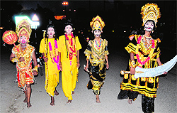 Youngsters dressed as characters from the Ramlila move around near Teenkoni in the city