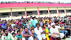 Crowds wait for the effigies to burn at the MSD School grounds