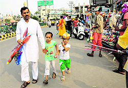 A man takes his children shopping for toys
