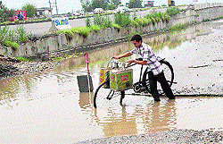 Deep potholes on the 'killer' GT Road in Jalandhar