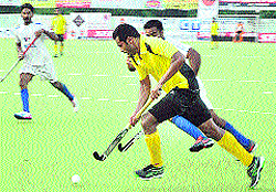 A match in progress during the ongoing 30th Indian Oil Surjit Hockey Tournament in Jalandhar on Sunday