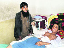 Victim Manzoor Ahmad Bumla being treated at a hospital in Srinagar.