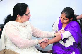 Dr Gursaran Sidhu examines a volunteer during an NSS camp at GNN College in Doraha on Sunday