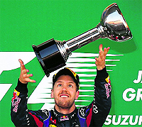 Red Bull driver Sebastian Vettel celebrates after winning the Japanese Grand Prix on Sunday