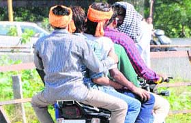 Courting disaster: Five men ride a motorcycle, throwing traffic norms to the wind in Amritsar on Monday