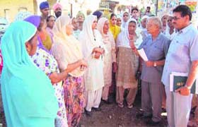 The aggrieved family members of militancy victims speak to BJP leader Baldev Raj Chawla (second from right) in Amritsar on Monday
