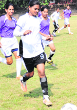 A match in progress in the ongoing Inter-College Football Tournament for Women at Panjab University on Monday. Tribune photo