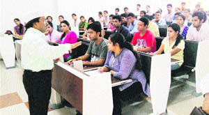Dr Pawan Aggrawal addresses students at GJU, Hisar.  
