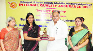 Vice-Chancellor Pankaj Mittal honours Vidhan Sabha Speaker Kuldeep Sharma during a seminar at Bhagat Phool Singh Women University, Khanpur Kalan. 