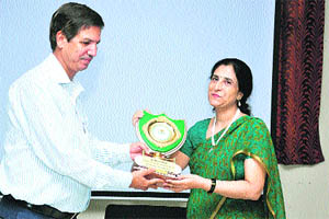  Dr RC Siwach, Director, Bhagat Phool Singh Government Women Medical College, Khanpur Kalan, presents a memento to Dr Neera Dhar during the inaugural session of a two-day seminar at the college. 