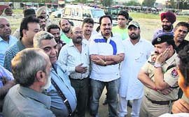 Police officials conduct a probe in the illegal running of 96 cracker shops at Burlton Park in Jalandhar on Monday.