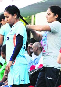 Players of the Punjab XI (India) hockey team get ready for the match against Punjab XI (Pakistan) during the 30th Indian Oil Surjit Hockey Tournament in Jalandhar on Monday.